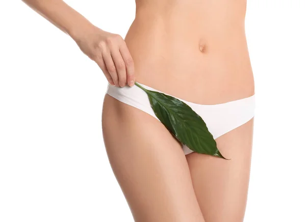 Woman with leaf showing smooth skin after bikini epilation on white background, closeup. Body care concept — Stock Image Woman Leaf Showing Smooth Skin Bikini Epilation White Background Closeup Stock Photo