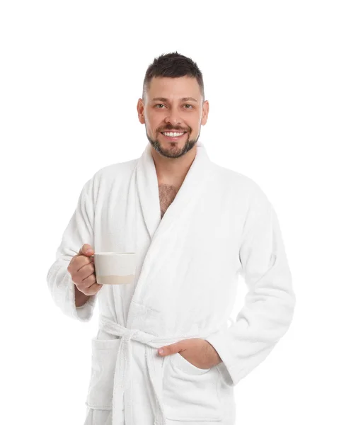 Handsome man with cup of coffee wearing bathrobe on white backgr — 스톡 사진