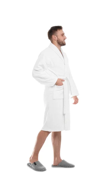 Schöner Mann im Bademantel auf weißem Hintergrund — Stockfoto