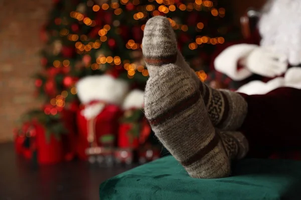 Santa Claus Wearing Woolen Socks Blurred Christmas Lights Closeup — Stock Photo, Image