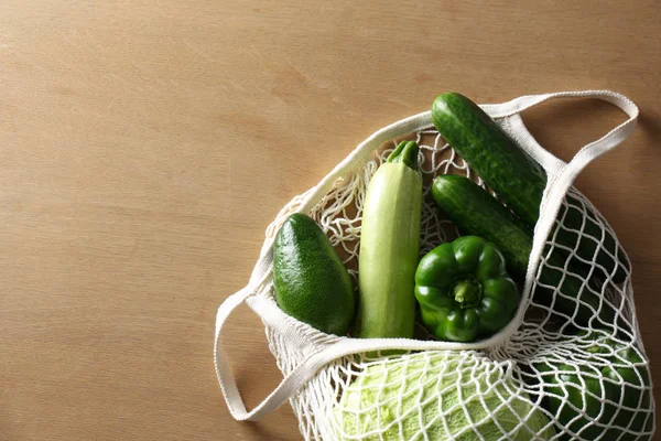 Different Fresh Vegetables Eco Mesh Bag Wooden Table Top View — Stock Photo, Image