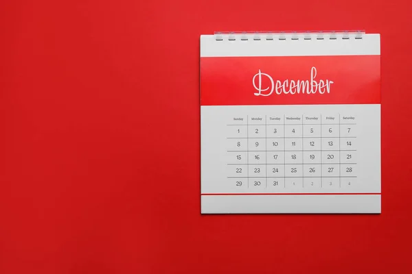 Calendário Dezembro Fundo Vermelho Vista Superior Espaço Para Texto — Fotografia de Stock