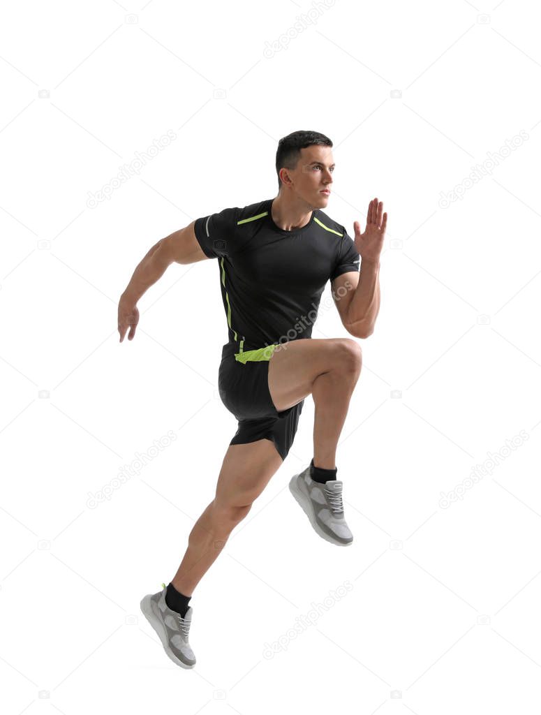 Athletic young man running on white background