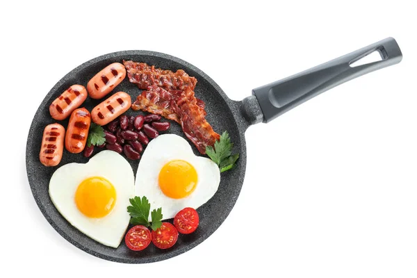 Delicious breakfast with heart shaped eggs and sausages isolated — ストック写真