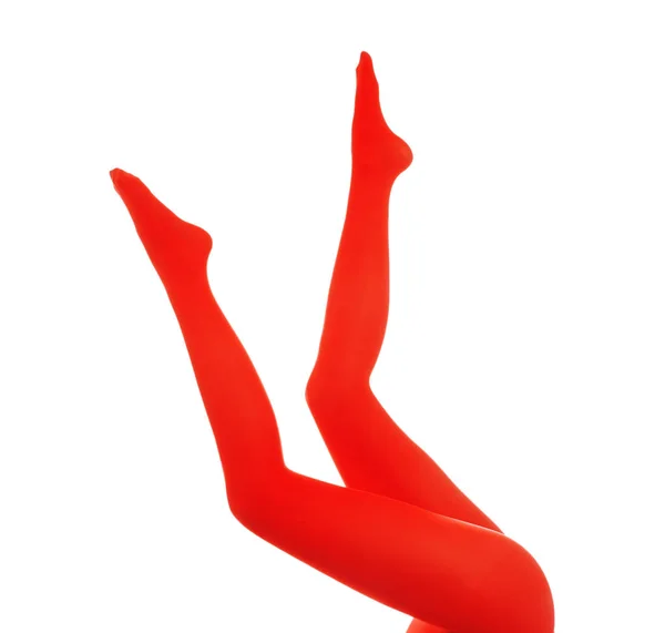 Frau trägt rote Strumpfhosen auf weißem Hintergrund, Nahaufnahme der Beine — Stockfoto