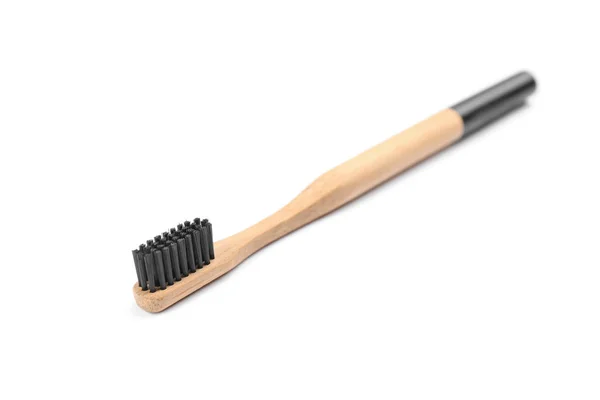 Bamboo toothbrush with charcoal bristle isolated on white — Stock Photo, Image