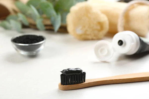 Bamboo Toothbrush Charcoal Paste White Table Closeup Space Text — Stock Photo, Image