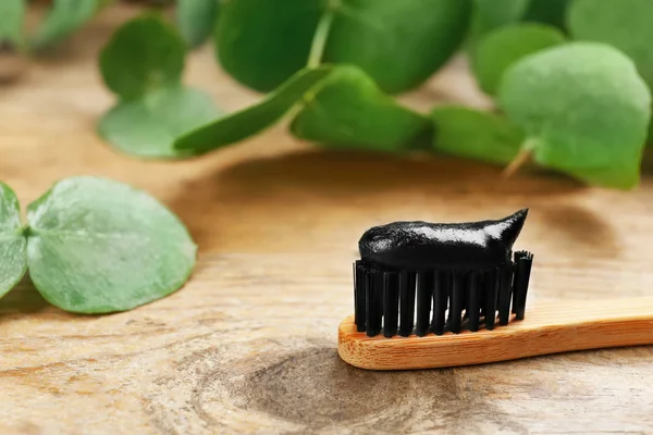 Bamboo Toothbrush Charcoal Paste Wooden Table Closeup Space Text — Stock Photo, Image