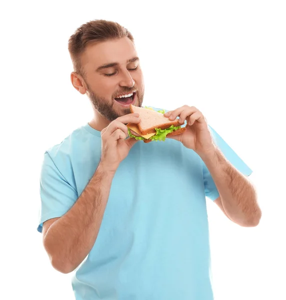 Jovem Comendo Saboroso Sanduíche Fundo Branco — Fotografia de Stock