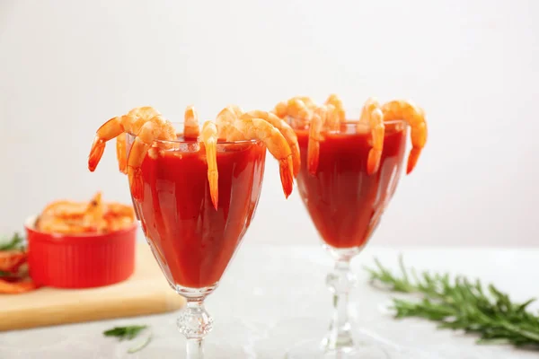 Delicious shrimp cocktail with tomato sauce served on  table