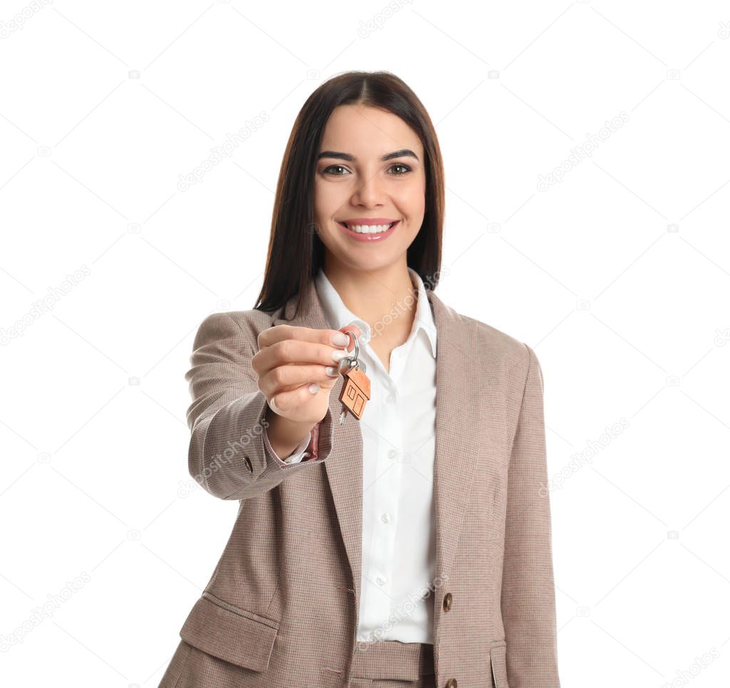 Real estate agent holding key on white background