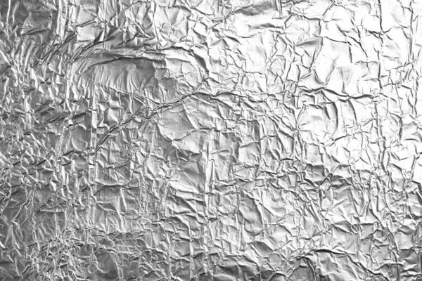 Crumpled silver foil as background, closeup view — Stock Photo, Image