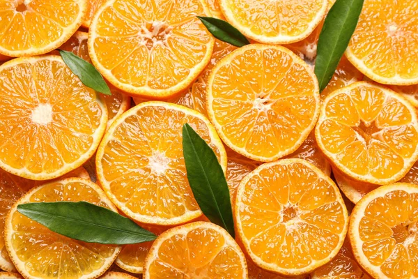 Řezy Čerstvých Zralé Mandarinky Listy Jako Pozadí Horní Pohled Citrusové — Stock fotografie
