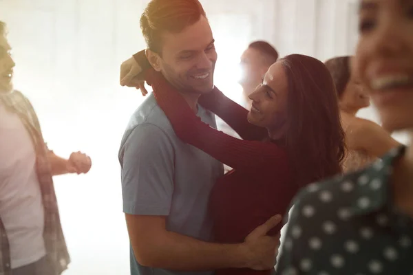 Lovely young couple dancing together at party — Stock Photo, Image