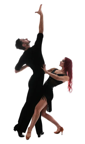 Leidenschaftliches junges Paar tanzt auf weißem Hintergrund — Stockfoto