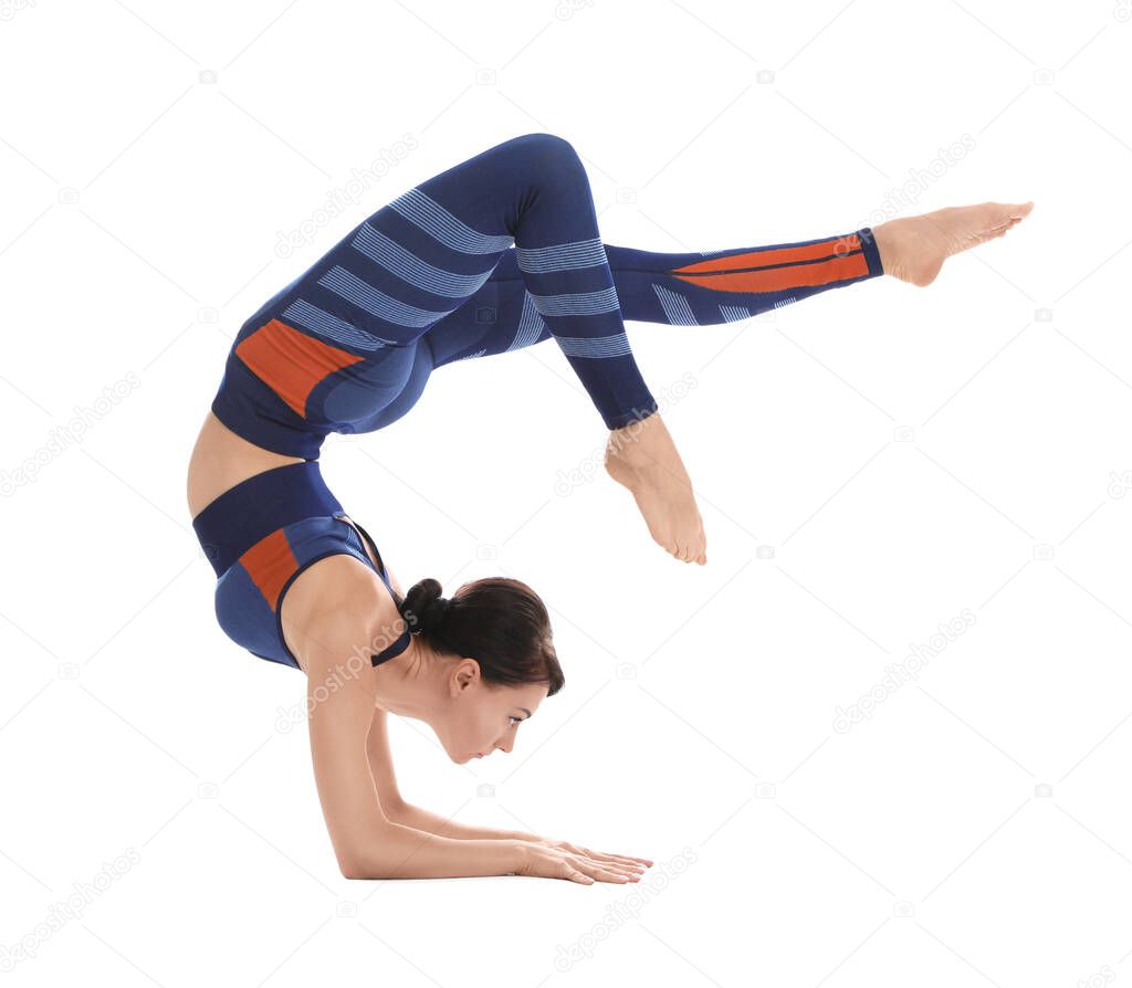 Professional young acrobat exercising on white background