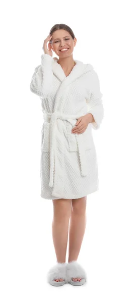 Jonge vrouw in badjas op witte achtergrond — Stockfoto