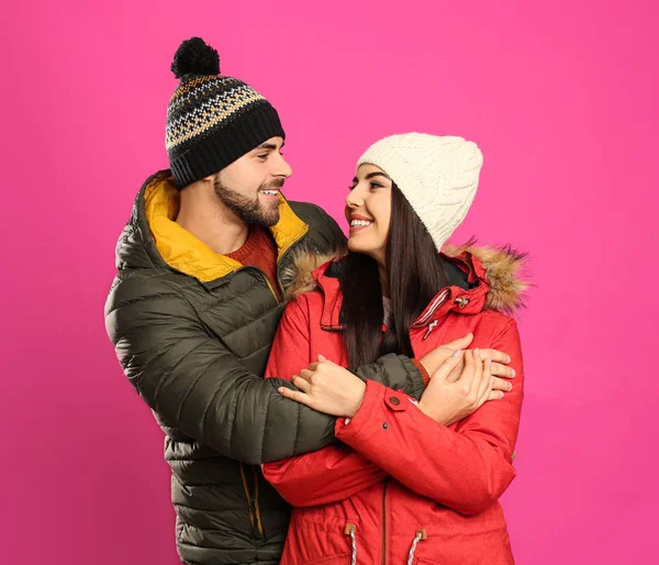 Happy Young Couple Warm Clothes Pink Background Winter Vacation — Stock Photo, Image