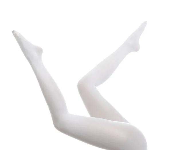 하얀 배경에 멋진 스타킹을 쓰고 있는 여자, 다리를 감고 있는 여자 — 스톡 사진