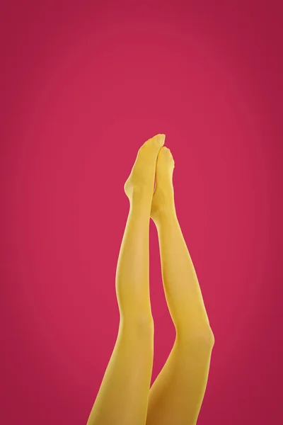 Woman Wearing Yellow Tights Crimson Background Closeup Legs — Stock Photo, Image