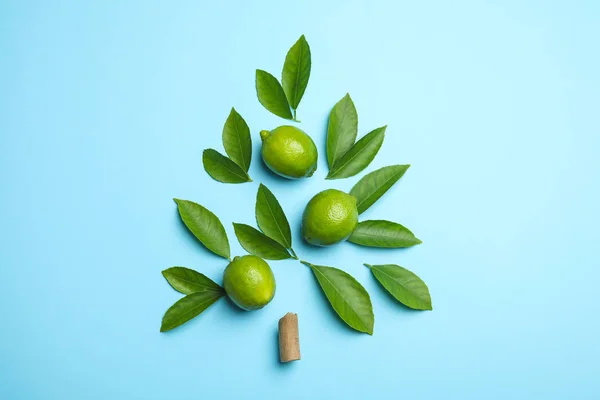 Composizione flat lay con foglie di agrumi freschi verdi e lime su — Foto Stock