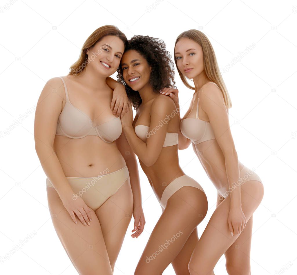 Group of women with different body types in underwear on white background