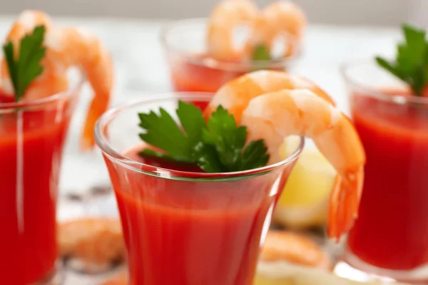 Delicious shrimp cocktail with tomato sauce, closeup