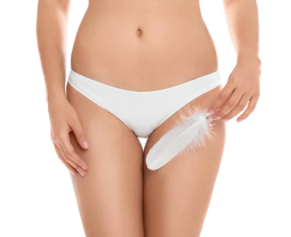 Woman with feather showing smooth skin on white background, closeup. Brazilian bikini epilation — Stock Image Woman Feather Showing Smooth Skin White Background Closeup Brazilian Bikini Royalty Free Stock Images