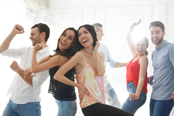 Couple of happy friends dancing at party — Stock Photo, Image