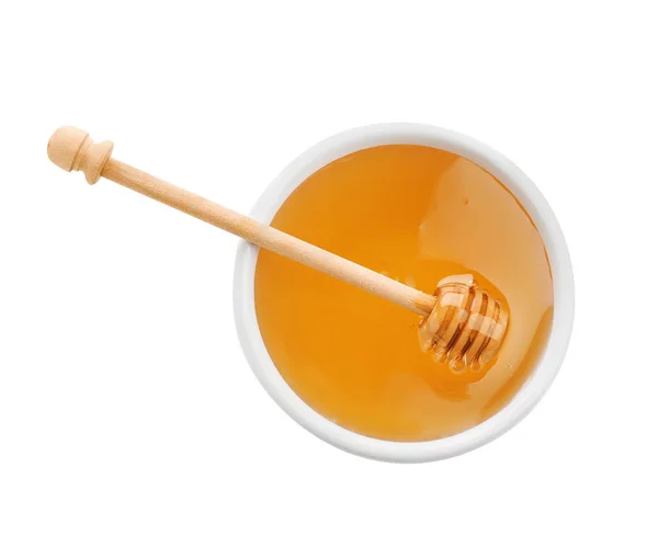 Bowl of organic honey and dipper isolated on white, top view — Stock Photo, Image