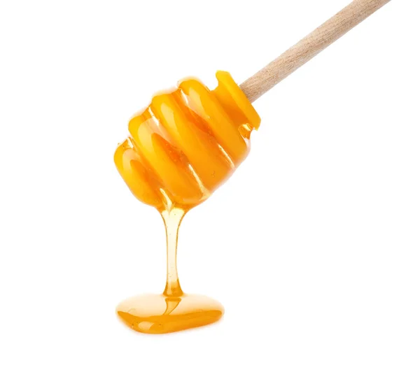 Miel que vierte de la cacerola aislada en blanco —  Fotos de Stock