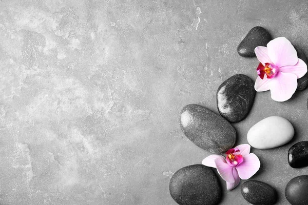 Stones Orchid Flowers Space Text Grey Background Flat Lay Zen — Stock Photo, Image