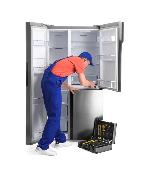 Male Technician Repairing Refrigerator White Background — Stock Photo, Image