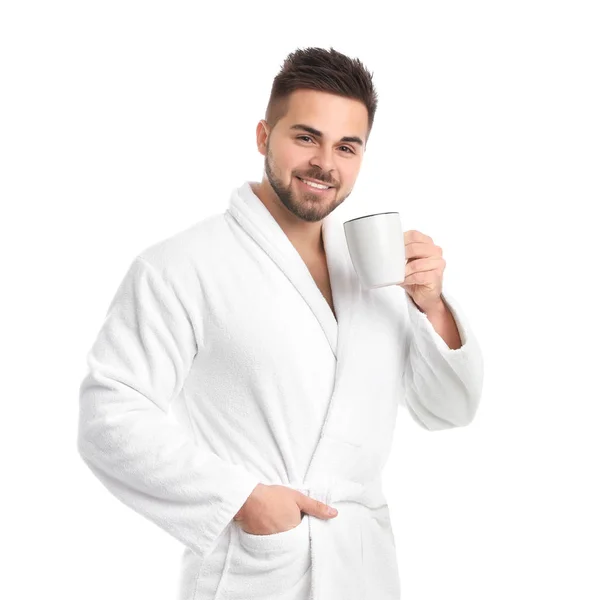 Beau homme en peignoir avec une tasse de café sur fond blanc — Photo