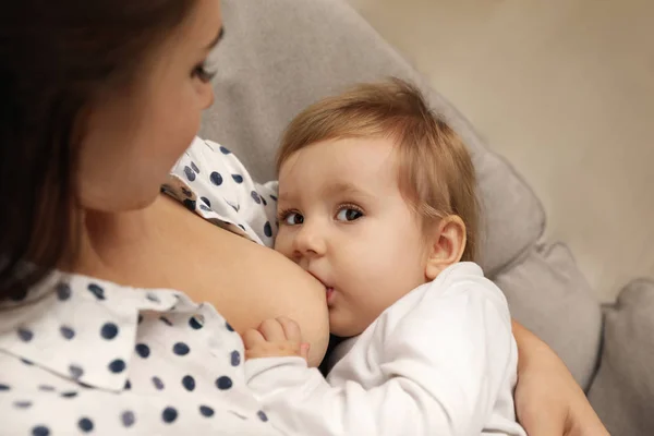 Woman breastfeeding her little baby at home, closeup — Stock Photo, Image