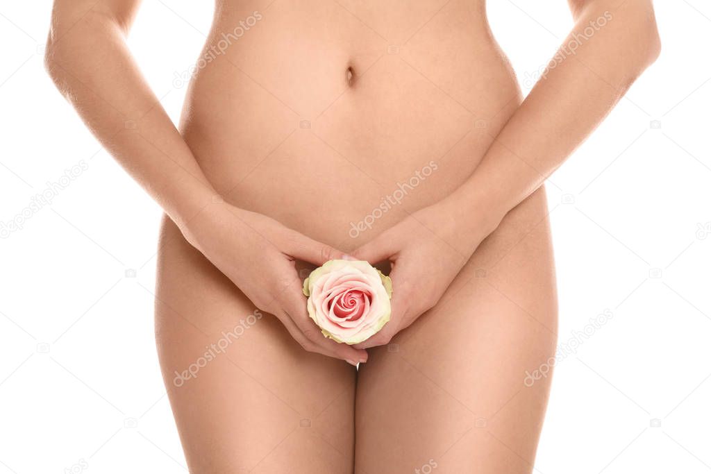 Woman with rose showing smooth skin on white background, closeup. Brazilian bikini epilation