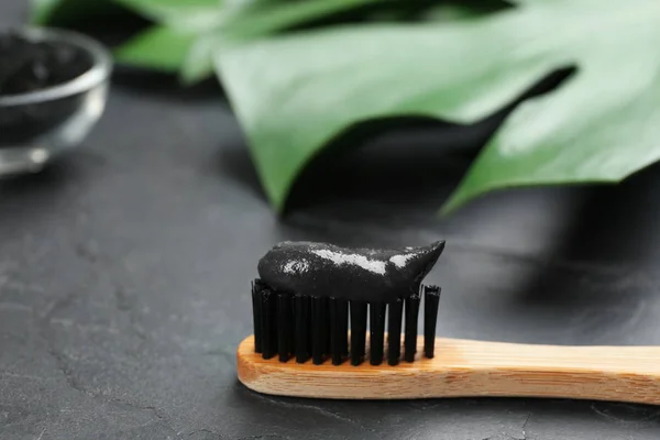 Bamboo Toothbrush Charcoal Paste Black Stone Table Closeup Space Text — Stock Photo, Image