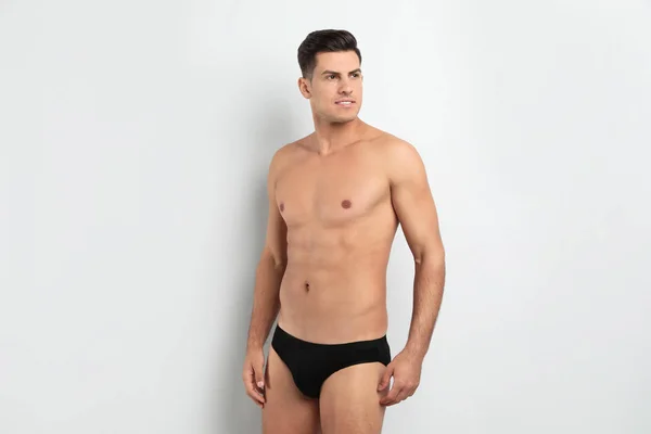 Handsome man in black underwear on white background — 스톡 사진