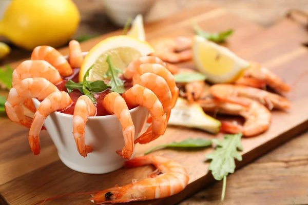 Delicious shrimp cocktail served on board, closeup