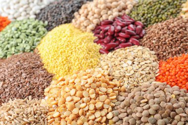 Different types of legumes and cereals as background, closeup. Organic grains clipart