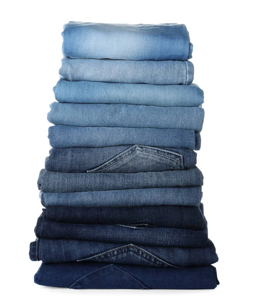 Stapel van verschillende jeans geïsoleerd op wit — Stockfoto