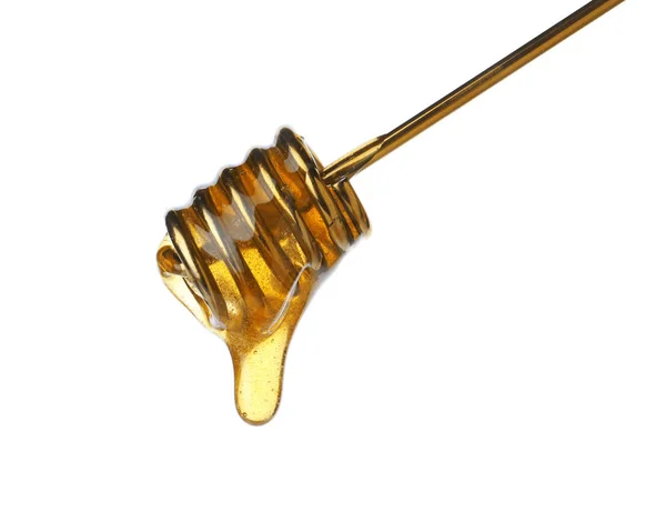 Honey pouring from metal dipper isolated on white — Stock Photo, Image