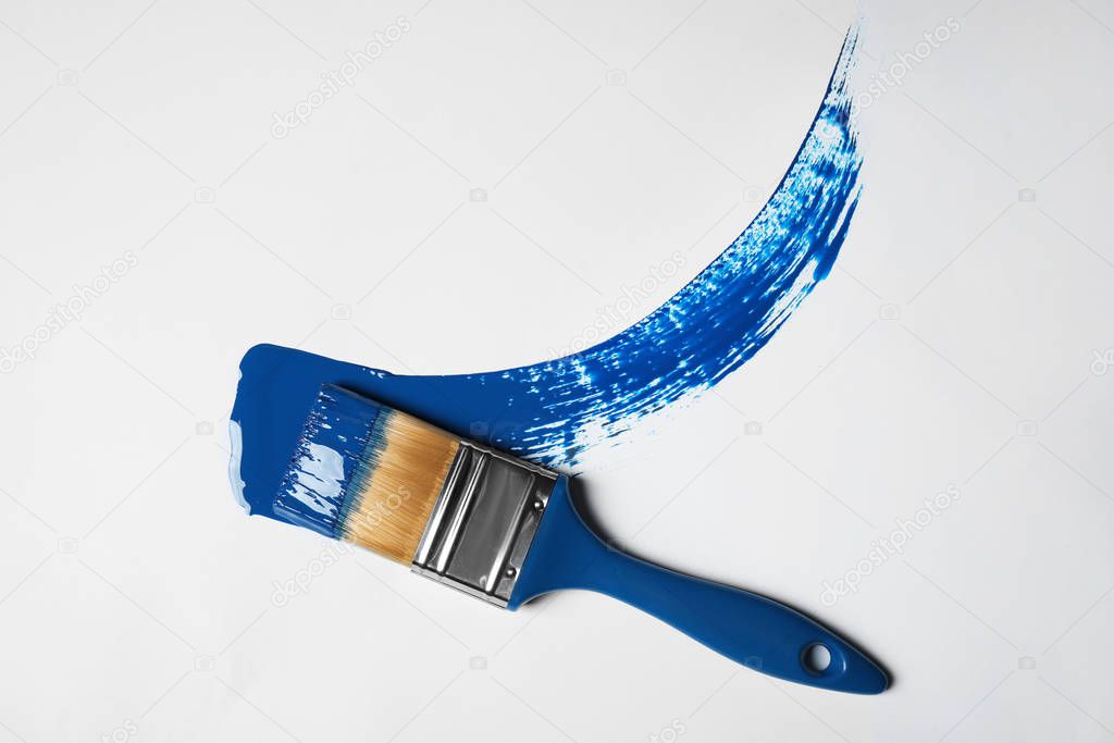 Brush and paint stroke on white background background, top view. Color of the year 2020 (Classic blue)