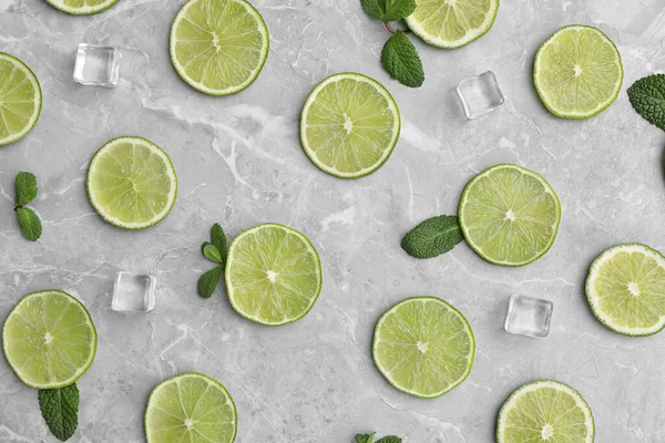 Flat Lay Composition Slices Fresh Juicy Limes Marble Table — Stock Photo, Image