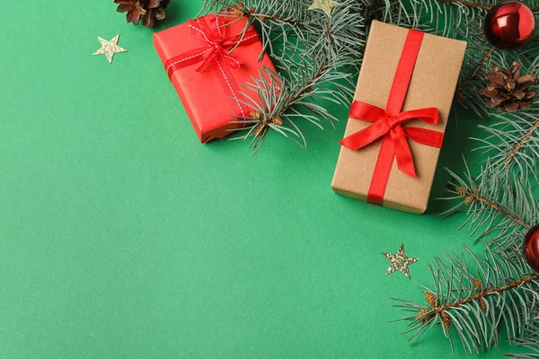 Flat Lay Composition Decorated Fir Branches Gifts Green Background Space — ストック写真