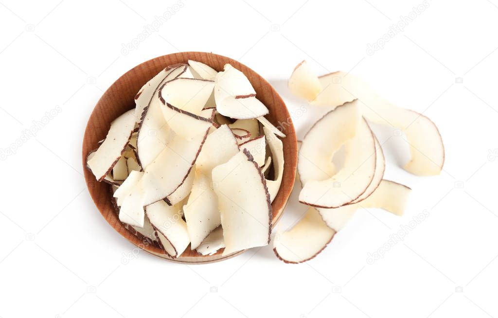 Tasty coconut chips in wooden bowl isolated on white, above view