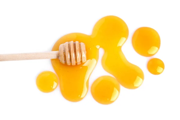 Droppar av honung och strömstare på vit bakgrund, ovanifrån — Stockfoto