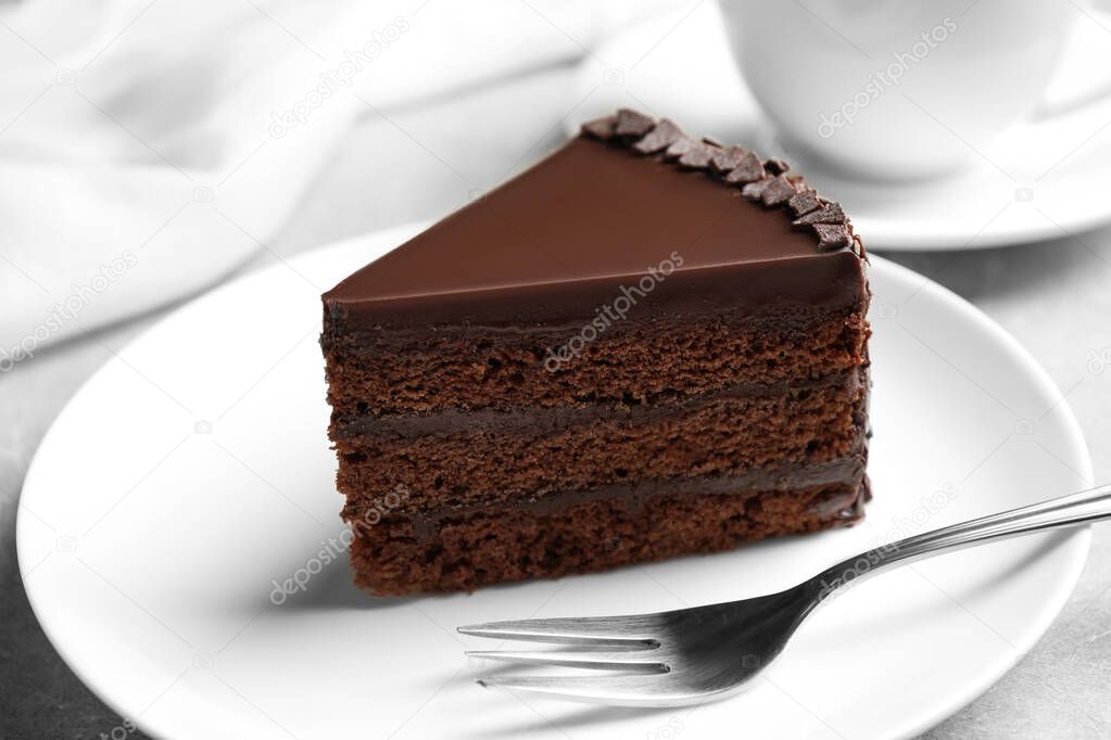 Piece of tasty chocolate cake served on plate