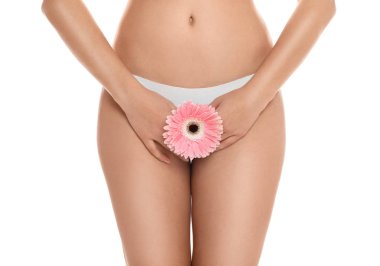 Woman with gerbera showing smooth skin on white background, closeup. Brazilian bikini epilation clipart