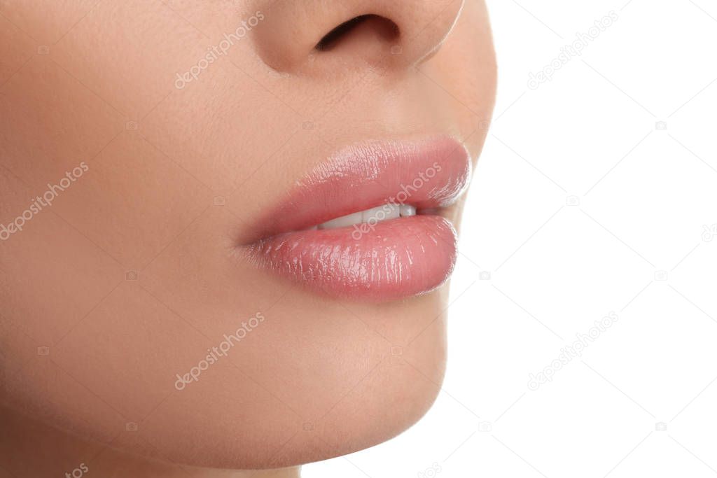 Woman with beautiful full lips on white background, closeup